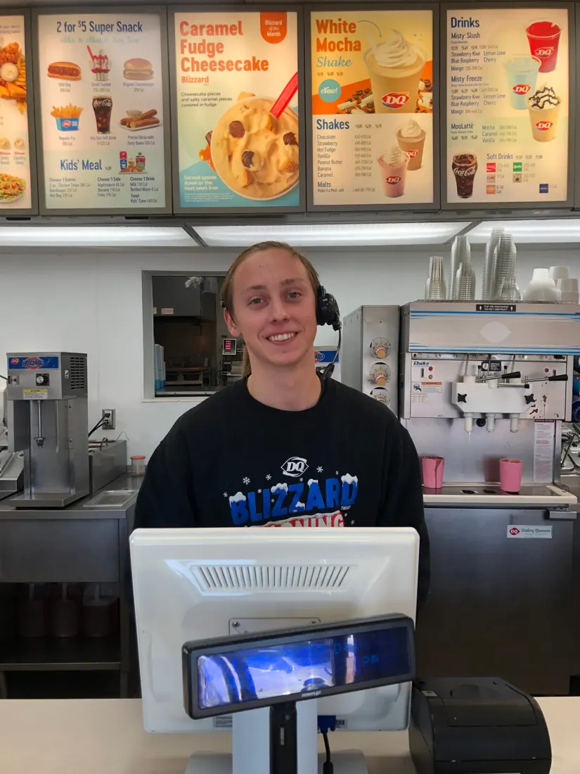 Sebastian smiling behind the counter at Dairy Queen