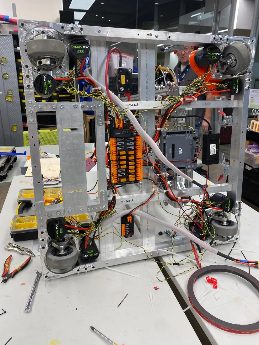 A robot drivebase with motors, controllers and wiring exposed